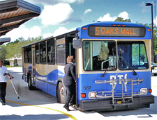 A photo of a bus stopping at the bus station